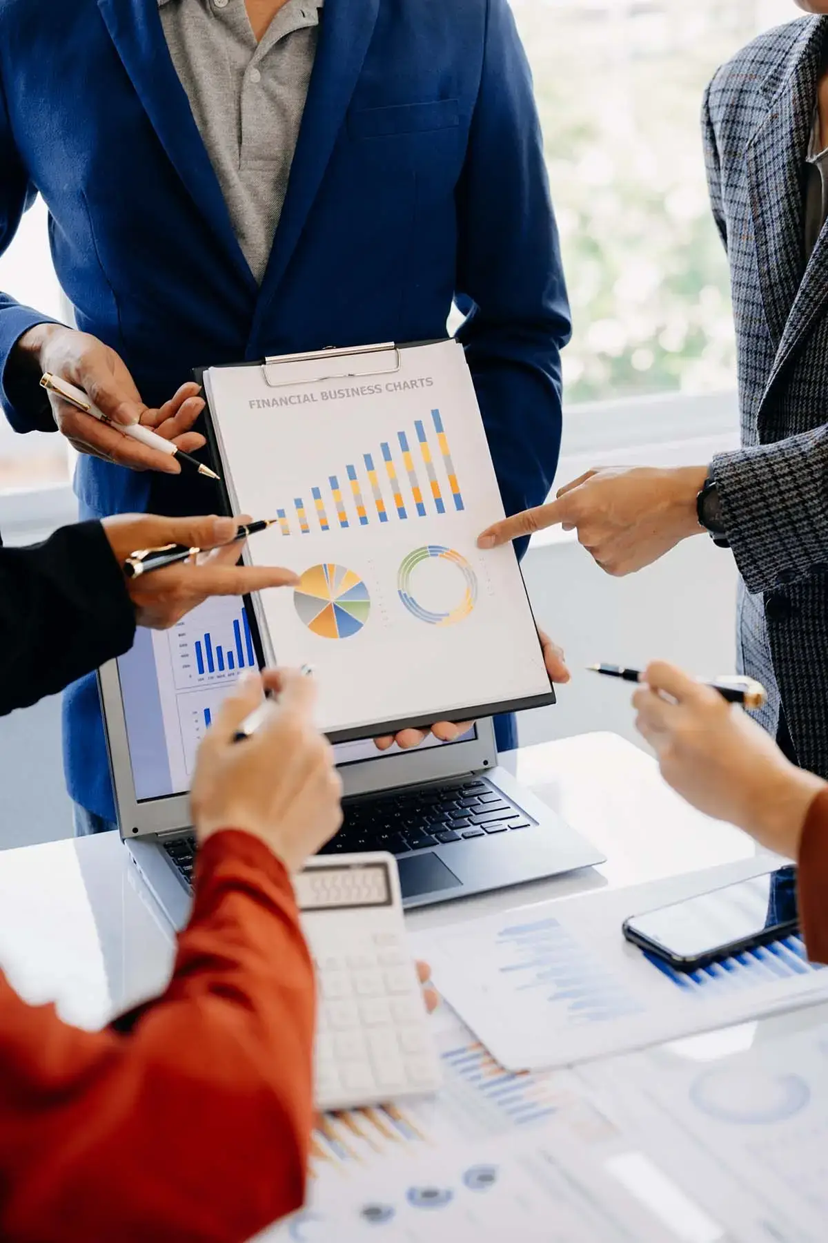 Business team reviewing charts and website performance information